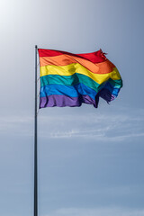 Rainbow flag blowing in the wind in the Castro District San Francisco