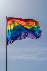 Rainbow flag blowing in the wind in the Castro District San Francisco