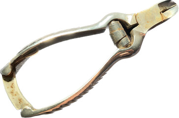 vintage nail cutter in rusty steel. toe scissors. dirty and ancient clippers. image with neutral background. hand holding body care object.