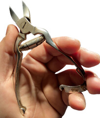 vintage nail cutter in rusty steel. toe scissors. dirty and ancient clippers. image with neutral background. hand holding body care object.