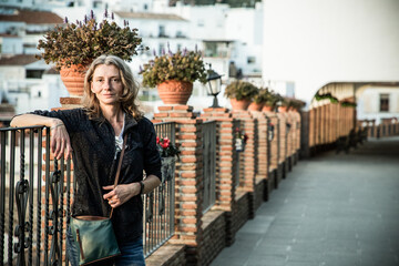 woman strolling in picturesque village of  Mijas. Costa del Sol  Andalusia  Spain - obrazy, fototapety, plakaty