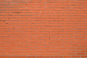 New Brick wall painted with red paint.