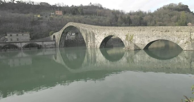 view of the Ponte della Maddalena or Ponte del Diavolo in Borgo a Mozzano Lucca. tuscany Italy