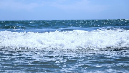 Blue sea  wiht wave and blue sky background. Summer sea and blue sky.