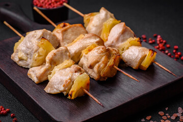 Delicious chicken or turkey kebab with pineapple pieces on skewers