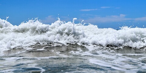 Blue sea  wiht wave and blue sky background. Summer sea and blue sky.