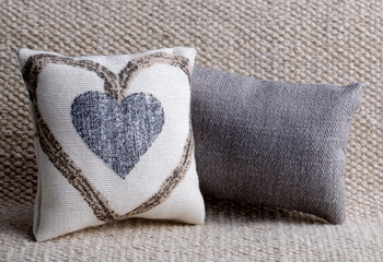 Cushion with heart shape on the sofa