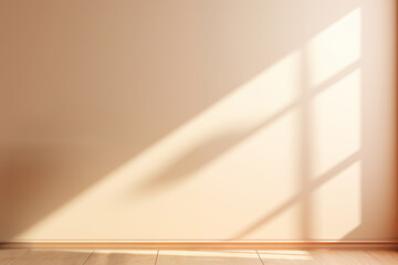 Warm sunlight filters through a window, casting soft shadows on a plain beige wall and wooden floor - obrazy, fototapety, plakaty