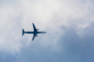 Passenger plane passing through the clouds