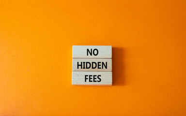 No hidden fees symbol. Concept word No hidden fees on wooden blocks. Beautiful orange background. Business and No hidden fees concept. Copy space