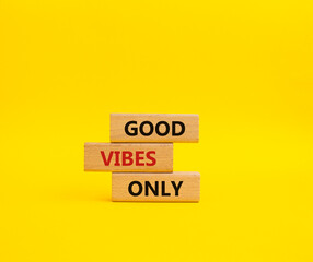 Good Vibes only symbol. Concept words Good Vibes only on wooden blocks. Beautiful yellow background. Business and Good Vibes only concept. Copy space.