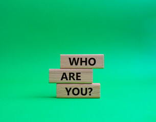 Who are You symbol. Concept words Who are You on wooden blocks. Beautiful green background. Business and Who are You concept. Copy space.