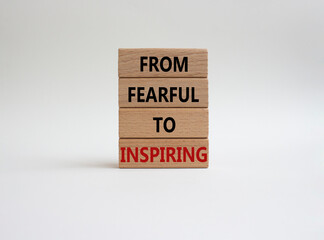 From Fearful to Inspiring symbol. Concept words From Fearful to Inspiring on wooden blocks. Beautiful white background. Business and From Fearful to Inspiring concept. Copy space.