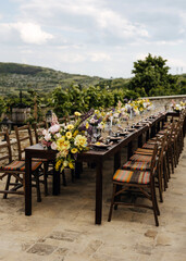 Fototapeta na wymiar Outdoor wedding dining setup with rustic charm at a winery.