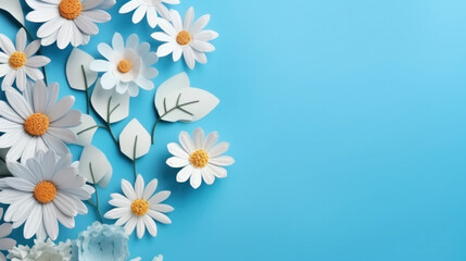 Fototapeta premium Spring flowers on blue background with copy space
