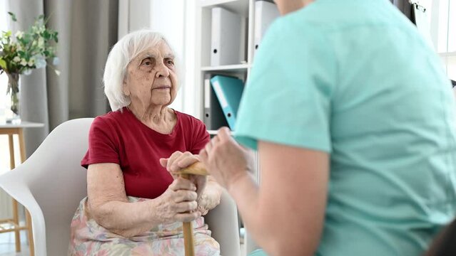 Doctor Explains House Rules To Old Woman In Nursing Home