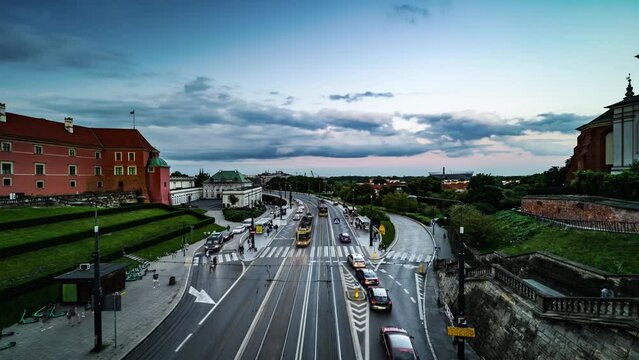 4K Time Lapse, floating clouds over traf ic on a streen in historical center of Warsaw, Poland