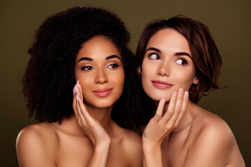Portrait of two tender lady use new moisturizing cream for face skin look copyspace isolated on khaki color background
