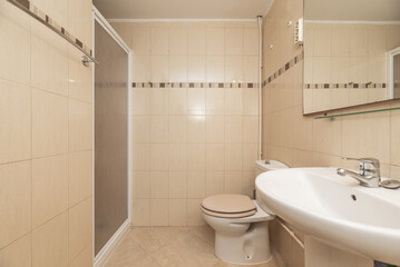 Naklejka na ściany i meble bathroom with frameless mirror on the wall, white porcelain toilets, shower cabin