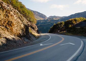 Sunset on an empty road in the mountains. 
Empty road in the mountains in argentine patagonia.