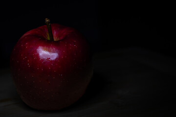red apple on black