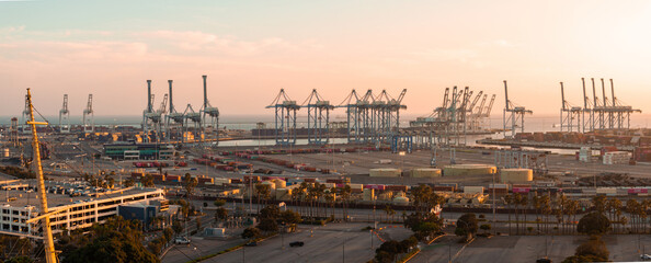 Fototapeta premium Thousands of shipping containers in the port of Long Beach near Los Angeles California. The Port of Long Beach in southern California during sunset.