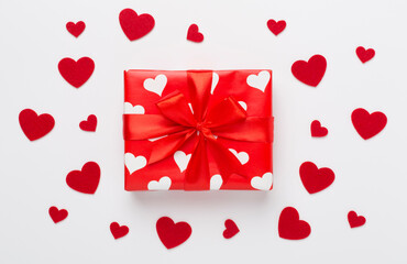 Gift box with hearts on color background, top view. Valentines day concept