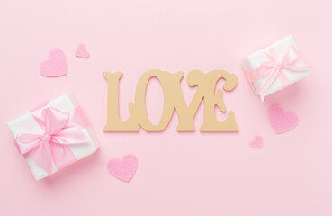 Valentines day composition with gifts on color background, top view.