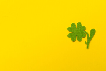 Felt clover leaves on color background, top view. St. Patricks day concept