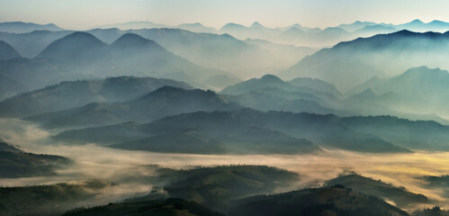 silhouettes of morning mountains. foggy morning in the Carpathians. Mountain landscape - obrazy, fototapety, plakaty