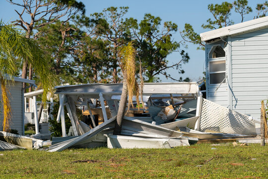 Natural disaster consequences. Severely damaged by hurricane mobile homes in Florida residential area