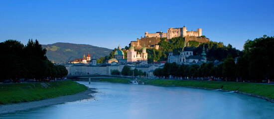 Fototapeta na wymiar fortress castle Hohensalzburg while sunset, above river Salzach in Salzburg, Austria, Europe