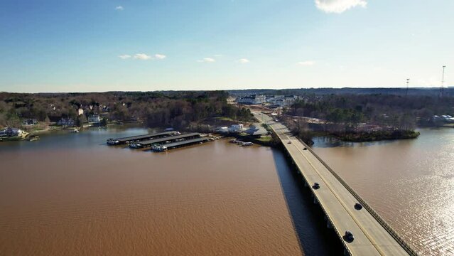 Cars traverse bridge over Lake Wylie and cross state line on a sunny afternoon