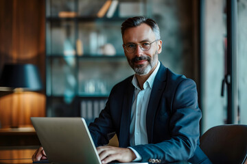 businessman with laptop in office desk