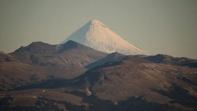 Alpine landscape in summer. View of volcano Lanin peak covered with snow and the Andes mountains in Patagonia Argentina.