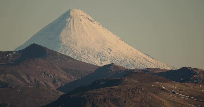 Alpine landscape in summer. View of volcano Lanin peak covered with snow and the Andes mountains in Patagonia Argentina.