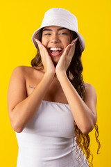 Naklejka premium young woman wearing white dress on a yellow background