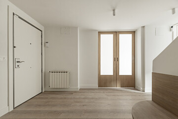 Hall of a house with smooth white painted walls