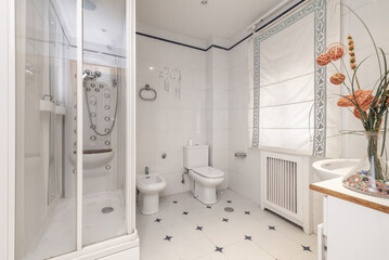 a bathroom with integrated mirror cabinet, shower cabin