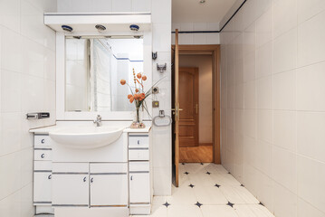 a bathroom with integrated mirror cabinet