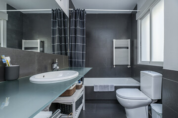 a modern design bathroom with matte gray porcelain walls