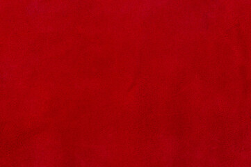 Red suede texture. Natural red dyed leather, suede macro photo.