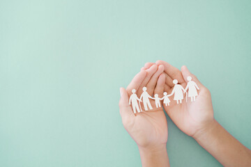 Hands holding diversity family, happy carer and volunteer, disable nursing home, rehabilitation and health insurance concept - obrazy, fototapety, plakaty