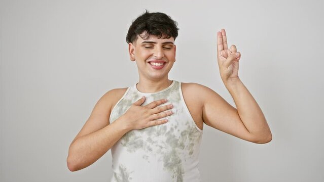Confident young man in sleeveless t-shirt solemnly swearing loyalty oath with hand on heart, proudly standing isolated on white background