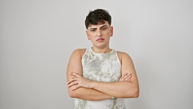 Young skeptic man in sleeveless t-shirt standing with crossed arms, wearing a nervous, disapproving expression on face. a negative person isolated over white background