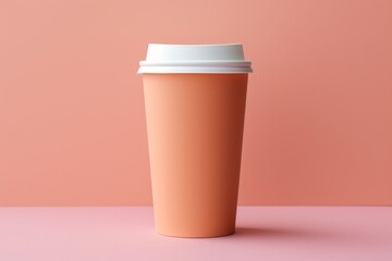 Mockup of a coffee cup in a trendy color. Background with selective focus and copy space