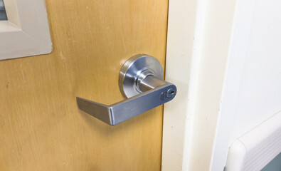 door handle close-up, portraying sophistication and access, inviting the viewer into a world of...