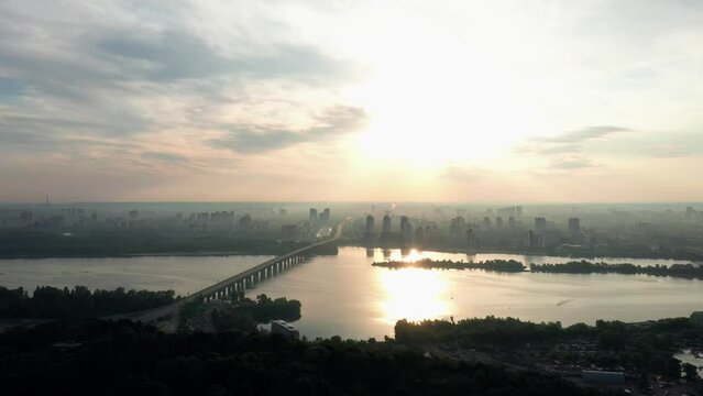 Dnipro river panoramic view at sunset. Beautiful city skyline in the background. Kiev, Ukraine.