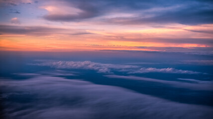 Fototapeta na wymiar Beautiful Sunset Skies seen from the Window of an Airplane