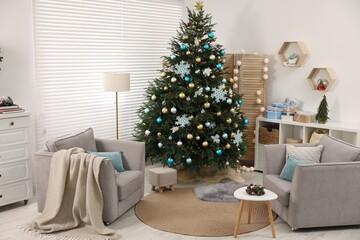 Christmas tree in room decorated for holiday. Festive interior design